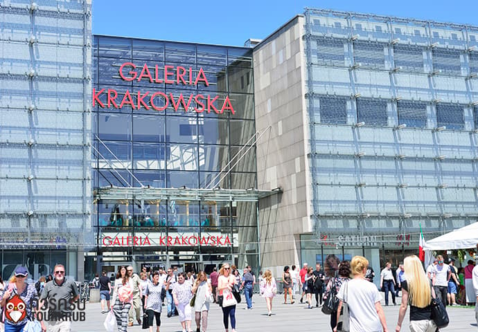 KRAKOW,POLAND more people walk at the entrance of Galeria Krakowska shopping center